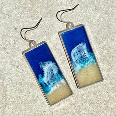 "These realistic beach earrings and necklace are made with layers of resin, bright colorful inks and real sand. These earrings are 43mm x 19mm. The pendant is on an 18\" chain. These are made to order and yours may be slightly different than those pictured." Handmade Ocean Color Jewelry For Summer, Handmade Ocean-inspired Sand Colored Jewelry, Handmade Sand-colored Ocean-inspired Jewelry, Handmade Ocean Color Summer Jewelry, Blue Resin Jewelry For Summer, Resin Jewelry For Summer Gifts, Summer Gift Jewelry Made Of Resin, White Resin Earrings For The Beach, Beachy Sand-colored Jewelry For Gift