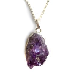 Amethyst Crystal Pendant Necklace. Multiple, natural amethyst points in a deep, dark purple give you ultimate purple perfection. Delight your neck with this whimsical, weighty chunk. Each stone is unique, so shape, clarity and size may vary. • 16" silver plate chain. Wear it close!• Lobster clasp closure• Silver electroplated base• Natural amethyst stone• Pendants average 25 mm wide, 25mm tall, 30mm thick Handmade in the USA in our Detroit, Michigan studio. This item is available for immediate s Purple Amethyst Pendant Crystal Necklace, Purple Raw Stone Crystal Pendant Necklace, Purple Amethyst Necklace With Raw Stone, Spiritual Purple Necklace With Large Stone, Purple Amethyst Crystal Necklaces With Natural Stones, Purple Raw Stone Crystal Necklace For Healing, Purple Raw Stone Necklaces For Healing, Spiritual Purple Crystal Necklace With Raw Stone, Healing Purple Crystal Necklace With Raw Stone