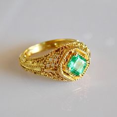 Exquisite geometric avant garde 18k solid Gold Emerald Ring. Material: 18k solid Gold Stone: Pristine AAA+ grade natural Columbian Emerald All our Stones are Ethically sourced. Made with Love at our Temple Jewels studio in ibiza. Custom orders Welcomed! Free world wide shipping. Sizing included For more rings: https://www.etsy.com/shop/templejewelsibiza/items?section_id=21449468 To my shop: https://www.etsy.com/shop/templejewelsibiza Exquisite 14k Gold Emerald Ring, Antique 14k Gold Emerald Ring, Elegant 14k Gold Multi-stone Emerald Ring, 14k Gold Emerald Ring With 17 Jewels - Collectible, 14k Gold Green Emerald Ring, Fine Jewelry, Gold Emerald Ring, New Saree Blouse Designs, Columbian Emeralds, Emerald Ring Gold