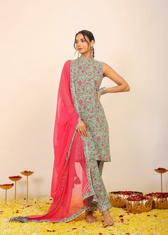 *Immerse yourself in the kaleidoscope of multi-colored florals with our meticulously crafted print, designed to turn every day into a blossoming celebration.  *The three-piece set is a testament to modern elegance, featuring a sleeveless kurta adorned with a high neckline.  *The relaxed fit ensures both comfort and style, creating an effortlessly chic silhouette that allows you to move with grace and confidence.  *The coordinating pant continues the floral story, while the pink dupatta adds a to Multicolor Floral Print Palazzo Set For Weddings, Wedding Floral Print Multicolor Palazzo Set, Wedding Palazzo Set With Floral Print, Green Bollywood Style Sharara With Floral Print, Bollywood Style Green Floral Sharara, Wedding Multicolor Floral Print Palazzo Set, Green Floral Print Sharara With Straight Kurta, Green Sharara With Floral Print And Straight Kurta, Multicolor Fitted Sleeveless Sharara