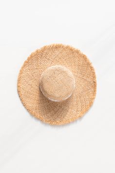 A classic summertime staple for a romantic warm-weather look, the Collioure Hat is perfect for days spent in the sunshine. With lovely vintage-inspired florals around the crown, this hat is available in tan straw with either black or white fleur details. Please Note- This item is final sale only. . Details: 17.5" Total Diameter 22" Around Crown, Adjustable Inner Ribbon Material: 100% Raffia, Polyester Inner Ribbon Imported Spring Coastal Boater Hat Made Of Toquilla Straw, White Bohemian Straw Hat For Day Out, Cream Toquilla Straw Hat For Vacation, Cream Panama Hat With Curved Brim For Vacation, Upf 50+ Curved Brim Hat For Picnic, White Toquilla Straw Boater Hat For Beach, Chic Straw Panama Hat For Warm Weather, White Coastal Hat For Spring, White Bohemian Straw Hat For Spring