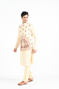 Rajasthani floral Hand embroidered nehru kurta set made in cream bamberg raw silk. Paired with cream slim fit Pant Pajama. Color of the actual garment may vary due to lighting conditions during the shoot.

Size Chart For Men





	
	
					Men's Size Chart
		

		
		
						
				Size Chart For Men
				Custom Size Measurement Guide
			
			
				
				
				Custom Size Measurement Guide
1. Take your measurements at ease…don’t hold your breath!
2. Be a little generous with the measurements. It’s always e Off-white Churidar With Straight Kurta, Cream Cotton Silk Kurta With Traditional Drape, Festive Cream Cotton Silk Traditional Wear, Designer Cream Kurta For Navratri, Designer Wear Cream Kurta For Navratri, Cotton Nehru Jacket With Floral Embroidery, Cotton Silk Nehru Jacket With Floral Embroidery For Diwali, Off White Chanderi Kurta For Diwali, Off White Raw Silk Straight Kurta Set