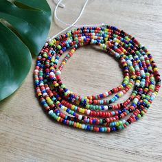 This colorful waistbead was made with multicolored glass seed beads.Waistbead length: 50 inches Strung on strong, cotton cord with 2 clear anchor beads (for adjustment) and 2 knots. Tie on, permanent waistbeads. Waist beads have been worn for centuries in African tradition, and the uses are endless. From adornment and weight management, all the way to signs of maturity and femininity, the diversity of waist beads make them appealing pieces of jewelry to own. They are generally worn under a garme Signs Of Maturity, African Traditions, Waist Beads, Glass Seed Beads, Cotton Cord, Weight Management, How To Make Beads, Seed Beads, Beaded Necklace