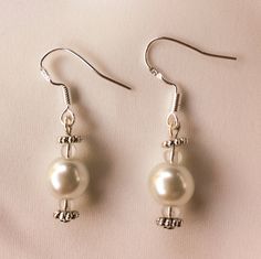 Elegant pearl bridal sterling silver earrings. Wedding, Bridal jewelry, bridesmaids gift, bridal earrings. Delicate Silver Pearl Earrings For Wedding, Sterling Silver Pearl White Earrings For Wedding, Wedding Pearl White Sterling Silver Earrings, Elegant Sterling Silver Pearl Earrings For Wedding, White Dangle Pearl Earrings For Bridal Shower, White Gold Pearl Drop Earrings For Wedding, White Gold Pearl Earrings For Wedding With Elegant Design, Classic Pearl Drop Earrings For Wedding, Classic Pearl Earrings With Elegant Design For Wedding