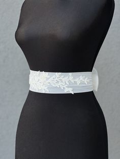 Wedding belt with train |Tulle Bow Bridal Sash | Ivory Bow Belt | Wedding Dress Sash| Over-sized Bow  Rhinestone Belt | Crystal Dress Sashes A stunning, elegant statement wedding sash is exquisitely beaded in beautiful vintage pattern. Your choice tulle  sash is attached to the beading and ties at the back into a bow.  An ultimate luxurious accent piece for your wedding dress or for any special occasion dresses. Accentuate your waist and add a touch of feminine charm to any dress with this tulle sash. Even the most simple gown can transform into a dreamy ensemble with this voluminous bow. Color embroidery - ivory Color tulle on photo - ivory The belt is made as a long ribbon that you can tie around your waist. Elegant Ribbon Bridal Belt For Wedding, Fitted White Lace Bridal Belt, White Fitted Lace Bridal Belt, White Bridal Belt For Bride, White Wedding Dress With Sashes, Satin Bridal Belt With Ribbon For Wedding, Fitted Lace Bridal Belt For Bride, Fitted Lace Bridal Belt For Ceremony, White Fitted Bridal Belt For Ceremony