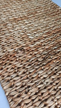 a close up view of the woven material on top of a tablecloth that has been made out of wicker