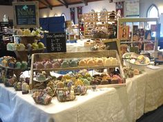 an assortment of pastries on display at a market