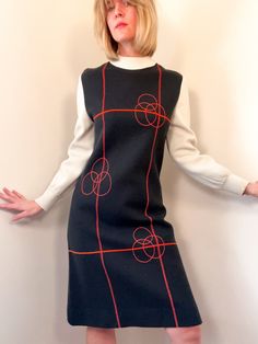 ⚡️ unique and rare 1960s space age mod-style shift dress with geometric pattern, mock neckline, and long sleeves. No remaining label. the material is a wool-blend knit with some sort of stretch built in. sturdy, warm, and holds its shape. excellent condition for an item of this age and kind! ⚡️ no labeled size, fits size medium  (modeled on size small, 5'5") ⚡️ shoulders 15.5" chest 18" waist 7"  length 39" sleeve length 23" ----------------------------------------------------------------------- 60s Space Age, 1960s Space Age, Space Age Fashion, 60s Mini Dress, Dress Geometric, Shift Dress Pattern, Mod Style, 60s Mod, Mod Fashion