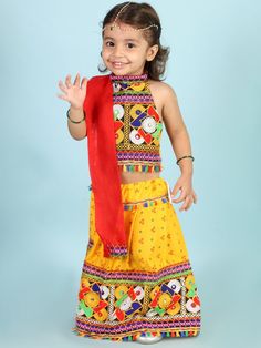 Specifications: Bright Yellow Bandhej Garba/Dandiya dress for girls. Type - Lehenga with choli, Dupatta Fabric - Cotton Sleeves - Short Neck - Halter Neck Waistband - String Occasion - Ethnic Wear Fit - Regular Fit Wash Care Instructions Gentle Wash Wash Dark Colors Separately Yellow Choli With Gota Work For Diwali, Yellow Choli With Mirror Work For Diwali, Navratri Festival Dress With Gota Work, Yellow Choli With Cutdana For Festivals, Yellow Cutdana Choli For Festivals, Traditional Yellow Dress For Navratri, Diwali Festival Dress With Gota Work, Multicolor Choli For Puja And Navratri, Multicolor Choli For Puja During Navratri