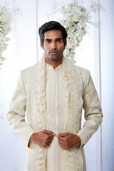 This sherwani set features appliques in soft lemons and pinks. It is paired with an off-white silk kurta and cotton a silk afghani salwar. Complimenting stole and footwear is also available.From Seema Gujral's Tuscan Summer collection. DELIVERY TIMEPlease allow 8-12 weeks for your outfit to arrive.FABRIC DETAILSNetProfessional cleaning only. Designer Off White Traditional Wear With Chikankari Embroidery, Designer Off-white Traditional Wear With Chikankari Embroidery, Designer Cream Kurta With Cutdana, Designer Cream Traditional Wear For Diwali, Designer Traditional Wear With Chikankari Embroidery For Ceremonies, Designer Off White Festive Sets, Designer Chikankari Embroidery Kurta For Traditional Ceremonies, Designer Chikankari Embroidery Kurta For Ceremonies, Bollywood Style Off White Bandhgala With Naqshi