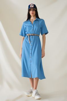 Introducing our Blue Maxi Shirt Dress with Polo Collar, a versatile and stylish piece perfect for spring and summer. This dress features a relaxed fit and maxi length, offering both comfort and elegance for any occasion.  Crafted from lightweight woven fabric, this dress is breathable and airy, making it ideal for warmer weather. The polo collar adds a touch of sophistication, while the button-up closure and short sleeves provide a classic and timeless look.  The dress comes with a belt made from the same fabric, allowing you to cinch the waist for a more defined silhouette or wear it loose for a relaxed vibe. Whether you're heading to a casual outing, a beach vacation, or a weekend brunch, this dress is sure to make a statement.  The model is wearing size S, with measurements of 33-24-36 Collared Midi Dress With Relaxed Fit For Summer, Relaxed Fit Collared Midi Dress For Summer, Chic Midi Shirt Dress For Vacation, Vacation Midi-length Shirt Dress, Summer Relaxed Fit Shirt Dress For Work, Summer Casual Collared Midi Dress, Cotton Maxi Shirt Dress For Beach, Casual Collared Midi Dress For Summer, Chic Collared Midi Dress For Beach