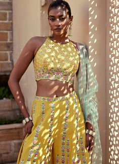 Buy Yellow Embroidered Pant Set by Chamee and Palak at Fabilicious Fashion! Shop made-to-measure Indian wedding wear and jewellery with fast shipping to USA, UK, and Canada. Yellow Silk Sets With Gota Work, Festive Yellow Palazzo Set With Cutdana, Summer Palazzo Set With Resham Embroidery For Reception, Yellow Resham Embroidery Sets, Yellow Bollywood Palazzo Set With Cutdana, Bollywood Style Yellow Palazzo Set With Cutdana, Summer Reception Sharara With Resham Embroidery, Festive Designer Embroidered Top With Mirror Work, Summer Silk Palazzo Set With Gota Work