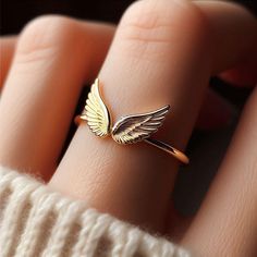 LITHIBITHI - TAMPA, FL - GOLD JEWELRY AND GIFTS ** Dainty Solid Yellow Gold Angel Wings Ring (also available in White and Rose Gold) ** Minimalist design featuring stunning wings on a 1.5mm wide band ** Perfect for everyday wear or as a thoughtful, nature-inspired gift ** Made with high-quality solid 10k gold (no plating or fillers) ** Beautifully packaged and gift-ready for any special occasion Includes one free resizing with purchase! (within 3 months) Angel Wings Ring, Wings Jewelry, Wings Ring, Angel Wing Ring, Angel Ring, Angel Wings Jewelry, Gold Schmuck, Gold Angel Wings, Gold Angel