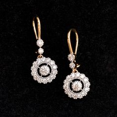 A stunning diamond dangle earrings are a perfect pair for your big day! With over a quarter carat of diamonds, these earrings sport a 0.10ct diamond in the center with a scalloped diamond halo which dangles beautifully from 2 diamonds! The ear wire is comfortable and can be locked for a secure fit! * Diamond Wt. : 0.85 Cts * Color-Clarity Grade : H-I, Vs-Si * Gold - 14K, 3 gms solid gold These earrings come in a lovely gift box with EGL certification. Find us on Instagram for exquisite designs: Formal Dazzling Diamond Earrings With Single Cut Diamonds, Exquisite Bridal Earrings With Diamond Accents, Diamond Drop Earrings For Wedding, Exquisite Bridal Drop Earrings With Diamond Accents, Wedding Drop Diamond Earrings, Elegant Yellow Gold Diamond Earrings With Single Cut Diamonds, Brilliant Cut Diamond Dangle Bridal Earrings, Exquisite Diamond Bridal Earrings With Halo Design, Wedding Diamond Drop Earrings