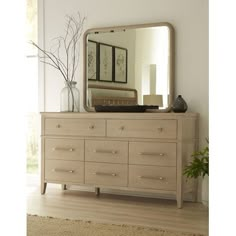 a dresser with a mirror on top of it