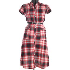 40s Vintage Red Black White Plaid Short Sleeve A Line Cotton Midi Dress Details: - white plastic buttons down entire front - classic 1940s A line dress - quilted piping vertical dress edging entire length of dress - large patch pockets trimmed in same quilted piping - gathered shoulder seams over bust area - split short sleeves held together with matching button - bodice meant to lightly blouse as result of front bodice waist pleats - 1950s belt included but not original to the dress - best for Quilt Dress, Vintage 40s, Cotton Midi Dress, 50s Fashion, Day Dress, White Plaid, Dress Clothes For Women, Cotton Dress, True Vintage