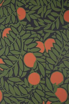 an orange and green wallpaper with leaves and fruit on it, in the background