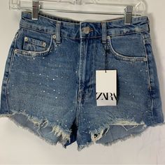 Zara Denim Distressed Embellished High Waisted Shorts Raw Hem New With Tag Size 2 Waist 13.5 Inch Hip 17.5 Inch Tags Festival Summer Beach Concert Bling Bling Y2k Rhinestones Spring High Waist Embellished Jeans, High-waist Embellished Jeans For Spring, Denim Blue Embellished Bottoms, Trendy Embellished Denim Blue Bottoms, Trendy High Waist Embellished Bottoms, Trendy High Waisted Embellished Bottoms, Embellished Denim Blue Denim Bottoms, Embellished High-waist Denim Bottoms, Mid-rise Embellished Denim Blue Bottoms