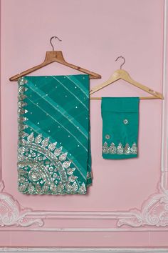 Flaunt your elegant style every day in this beautiful sea green georgette saree with embroidered scalloping border. It comes with a matching blouse piece. Disclaimer: The shown stitched blouse on the model is for display purpose only. The saree comes with a matching blouse piece and finished with fall and piko. Designer Green Sharara With Embroidered Border, Designer Wear Green Sharara With Embroidered Border, Green Sharara With Embroidered Border For Diwali, Green Semi-stitched Sharara With Embroidered Border, Semi-stitched Green Sharara With Embroidered Border, Bollywood Style Green Sharara With Embroidered Border, Green Sharara With Embroidered Border For Wedding, Green Embroidered Sharara For Wedding, Green Saree Set With Embroidered Border