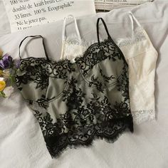 Fringe lace, slim short spaghetti strap top, super fairy lace breasted tank topMaterial:laceColor:black,ivoryFeatures:sweet,laceSize(cm):free 1inch=2.54cmlength:39,bust:70-86Note:Due to different measurement methods,there will be 1-3 error(unite:cm), please understand.&ltbr/>&ltp&gtPlease check the size carefully when you choose items,thank you.</p>&ltbr/> Sleeveless Lace Camisole With Lace Patchwork, Sleeveless Lace Crop Top With Lace Trim, Black Sleeveless Lace Top With Contrast Lace, Black Lace Contrast Camisole, White Contrast Lace Camisole, White Lace Contrast Camisole, White Camisole With Contrast Lace, White Contrast Lace Cami Camisole, Black Lace Trim Camisole Top