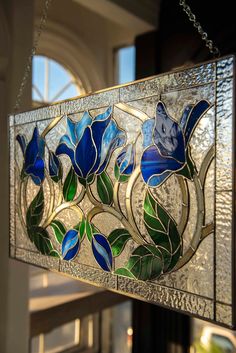 a stained glass window hanging from the ceiling