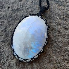 Beautiful handmade Macrame iridescent Rainbow Moonstone crystal pendant, with an adjustable black necklace cord. Rainbow Moonstone has a highly spiritual nature that is said to assist women in recognizing and embracing their innate personal power. It is known to encourage fervent desires, eager expectations, and heartfelt resolve and to balance the masculine-feminine vibrations within your body. This necklace is a unique creation that will shine the uniqueness within you! It can be a great gift Mystical Adjustable Crystal Necklace With Natural Stones, Adjustable Moonstone Crystal Necklaces For Meditation, Mystical Adjustable Moonstone Crystal Necklaces, Adjustable Mystical Moonstone Crystal Necklace, Adjustable Crystal Necklace With Large Stone In Spiritual Style, Adjustable Spiritual Moonstone Crystal Necklace, Adjustable Spiritual Crystal Necklace With Large Stone, Adjustable Crystal Necklace With Large Stone As Gift, Rutilated Quartz Jewelry