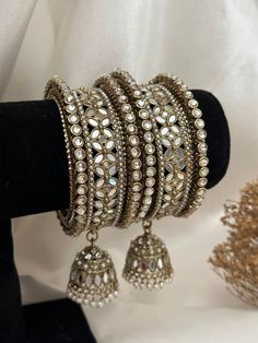 Mirror bangles set .  includes- 2 mirror middle kade with jhumki 4 raised kundan bangles . Mirror Bangles, Punjabi Bangles, Indian Bracelets, Bracelet Indian, Metal Bangles, Indian Bridesmaid Dresses, Kundan Bangles, Indian Bangles, Glass Bangles