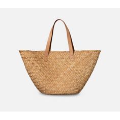 Market finds fit perfectly in this woven seagrass bag, with fully wrapped edges and durable leather straps. MeasurementsSmall: 22.5"L x 5.5"W x 12"HLarge: 23.5"L x 7"W x 14"HColor: Natural Seagrass Summer Basket Bag With Intrecciato Weave, Straw Bucket Shoulder Bag With Intrecciato Weave, Basket-shaped Straw Bag With Intrecciato Weave, Rectangular Natural Bags With Intrecciato Weave, Natural Rectangular Bag With Intrecciato Weave, Straw Shoulder Bag With Intrecciato Weave And Double Handle, Natural Rectangular Bags With Intrecciato Weave, Double Handle Straw Shoulder Bag With Intrecciato Weave, Natural Straw Bag With Intrecciato Weave For Daily Use