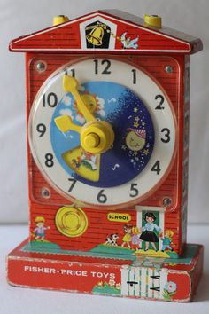 a red clock with yellow hands and numbers on it