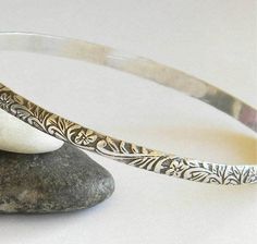 "A lovely vintage-look sterling silver bangle in a beautiful floral pattern. 4mm wide, a nice size to wear alone or stacked with your other bangles. Sterling silver bangles are a timeless accessory. They are so easy and comfortable to wear. Handmade by me, gently work-hardening the wire into a round shape, soldering the wire ends, oxidizing and finally, hand-polishing to a high shine. The seam where the two ends of the patterned wire meet will be visible on the inside surface of the bracelet, bu Bangle Stacking, Rodeo Jewelry, Stacking Bangles, Simple Bangle, Bangle Silver, Silver Bangle Bracelet, Sterling Silver Bangle Bracelets, Vintage Bangles, Simple Bracelets