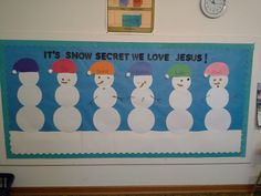 a bulletin board with snowmen on it and the words it's snow secret we love jesus