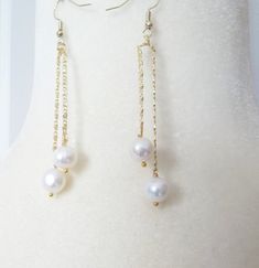 "An modern style white Akoya 9-10 mm pearl earrings, the earrings are 3\" long set in 14k gold plated vermeil french hook ear wires and chain, monitor colors may vary slightly, please add your phone number to ensure efficient delivery, this will only be  used for shipping purposes, packages with phone numbers will clear customs more speedily, thank you" White Linear Earrings For Pierced Ears For Party, Pearl White Akoya Pearl Chain Earrings, Pearl White Akoya Pearl Earrings With Pearl Chain, White Pearl Linear Earrings, Classic Pearl Earrings For Parties, Pearl White Akoya Pearl Earrings For Evening, Akoya Pearl White Pearl Earrings For Evening, Evening Akoya Pearl Earrings In Pearl White, White Pearl Linear Earrings Gift