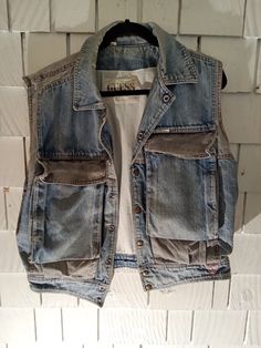 This is a 1980s guess brand all cotton denim vest  amazing front pockets and great vintage condition   ultra cozy Denim Vest 90s, Sleeveless Cotton Denim Jacket With Pockets, Utility Cotton Denim Vest With Pockets, Utility Style Cotton Denim Vest With Pockets, Medium Wash Vest With Pockets For Fall, Light Wash Cotton Denim Vest For Streetwear, Dark Wash Cotton Vest, Casual Light Wash Vest With Pockets, Sleeveless Cotton Denim Vest With Pockets