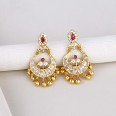 Add elegance and sophistication to your attire with this exquisite Silver Earring featuring a Semi Diamond Stone Chandhbali design. Made with 92.5 Silver and 24 kt gold plating, this stylish piece is adorned with semi-precious stones for a captivating look. Suitable for any occasion, from formal to casual. Height-48 mm width-32 mm   Note Product Care: To maintain the elegance of your silver jewelry, proper care is essential. Keep it away from sweat, water, and sleep to avoid tarnishing. Also, av