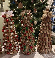 three wine cork christmas trees on a table