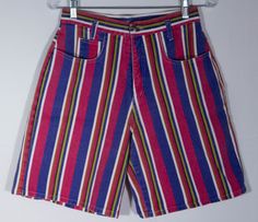 We ADORE these colorful, bright and bold print striped shorts! Here's a pair of striking, made in USA 80s collectible "Enchant" label jean shorts with a cute, fun style. The denim cotton print of stripes in vibrant colors are stunning with a great bare back pattern to the cut. These gem shorts are a rare find and definitely standout in a crowd. These cotton denim shorts really have that classic 80s look and cut and they are in really great overall condition with more minor signs of wear or use. Retro Multicolor Beach Shorts, Vintage Multicolor Shorts For Summer, Spring Multicolor Striped Bottoms, Multicolor Bermuda Bottoms For Spring, Multicolor Vertical Stripes Bottoms For Spring, Retro Multicolor Shorts, Spring Multicolor Vertical Stripes Bottoms, Retro Striped Short Bottoms, Retro Striped Short-length Bottoms