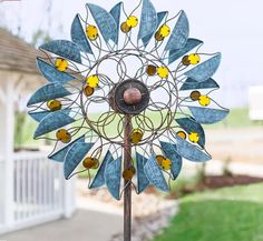 a wind spin with yellow and blue flowers on it