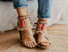 These Boho Sandals ankle belts will help you to completely transform any basic sandal into something stylish and unique. They are made with carefully selected ethnic materials, in a completely handmade process. With them, you will get those sandals that you wear everywhere and have super comfortable, have a different air when you want. In this way, you can enhance that Boho-Chic style that we love so much. This ad is for a pair of anklets, footwear is not included. If you need a custom design or for a girl, do not hesitate to write to me and we will design it together. The anklets are adjustable to fit a variety of widths. Handmade design Made with old trimmings from India, there are only 5 units available Adjustable leather straps Measurements for decorative part of the anklet are approx: Bohemian Ankle Strap Anklets For Festivals, Adjustable Open Toe Sandals For Festival, Adjustable Open Toe Toe-ring Sandals For Festivals, Bohemian Festival Anklets With Ankle Strap, Adjustable Open Toe Toe Ring Sandals For Festival, Bohemian Festival Anklets, Hippie Ankle Wrap Anklets For Summer, Handmade Hippie Anklets For Vacation, Traditional Summer Beach Anklets