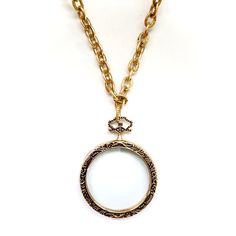 Handcrafted one-of-a-kind necklace, stunning giant vintage magnifying glass pendant, vintage toggle closure, finished with green leather and vintage danglers. Wear it long or doubled over. Dress it up or down, chic timeless classic and super stylish! The Necklace measures 30" in length Vintage brass chain Vintage magnifying glass pendant Made with love in Los Angeles Complimentary gift wrapping provided All sales final Vintage Locket Necklace With Lobster Clasp, Vintage Locket Necklace With Round Pendant, Vintage Necklace With Detachable Round Pendant, Vintage Brass Medallion Necklace With Adjustable Chain, Vintage Gold Toggle Necklace, Vintage Medallion Necklace With Chain, Over Dress, Magnifying Glass, Brass Chain