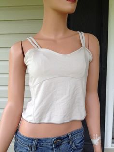 THIS TANK TOP IS NEW WITH TAGS!! NEVER WORN OUTSIDE, ONLY DISPLAYED IN A MAJOR DEPARTMENT STORE. PLEASE SEE ALL OF THE PICTURES BEFORE BIDDING! NEW BALANCE WOMEN'S DOUBLE STRAP TANK TOP NEW!! COLOR- TAN / BEIGE / OFF WHITE SIZE- MEDIUM  Support when you need it most. Feature double adjustable straps and built in shelf bra. Crop cut, sweetheart neckline. 90% polyester, 10% spandex Approximate measurements: bust 30", length (armpit to hem) 10" Please look at all pictures, use zoom option if needed Y2k Sleeveless Top With Built-in Bra, Fitted Beige Tops With Built-in Bra, Trendy Tops With Built-in Bra And Spaghetti Straps, Cropped Cotton Tops With Built-in Bra, Casual Tank Top With Built-in Bra And Medium Support, Casual Crop Top With Built-in Bra And Medium Support, Fitted Crop Top Camisole With Built-in Bra, Trendy Beige Crop Top With Built-in Bra, Fitted Crop Top With Built-in Bra For Summer