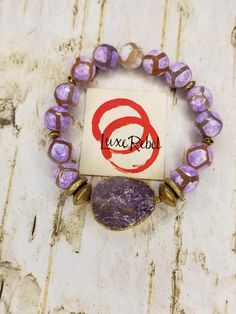 Gorgeous Lavender Tibetan gemstone bracelet with Amethyst gemstone focal. Middle Adjustable Purple Agate Beaded Bracelets, Purple Spiritual Bracelet Jewelry, Spiritual Purple Bracelet Jewelry, Lavender Natural Stones Bracelet For Gift, Purple Agate Beaded Bracelets As A Gift, Lavender Gemstone Bracelet As A Gift, Lavender Gemstone Bracelet Gift, Lavender Gemstone Bracelet For Gift, Purple Agate Bracelet With Natural Stones