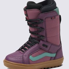 a pair of purple and green snowboard boots