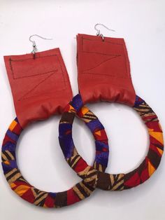 This listing is for a pair of mixed media earrings that are made of leather, fabric and wood. They are approximately 4.5 inches long. Very lightweight. Handmade Adjustable Hoop Earrings, Handmade Small Brown Hoop Earrings, Handmade Brown Small Hoop Earrings, Red Hoop Earrings For Festival, Handmade Red Drop Earrings, Adjustable Red Hoop Earrings, Unique Handmade Red Hoop Earrings, Unique Brown Hoop Earrings For Gift, Unique Adjustable Small Hoop Earrings