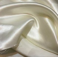 the white fabric is very soft and shiny