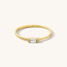 The Dainty Baguette Ring is effortlessly elegant, yet dainty enough to wear every day. You can dress it up or down; whether it’s a stroll in the sand or an evening in the city, this sweet ring is sure to make you feel gorgeous. DETAILS 14k gold vermeil -or- sterling silver ring 1mm band with cubic zirconia stone Sizes 5-8 available Safe for sensitive skin & shower safe Matching necklace: Dainty Baguette Necklace Bundle & Save up to 25% if you're buying multiple rings Baguette Necklace, Multiple Rings, Sweet Ring, Baguette Ring, Plain Bands, Dainty Bracelets, Stud Earrings Set, Ring Size Guide, Rings Simple