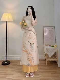 "🌿 This set includes traditional Ao Dai, pants. Style: Traditional Material: Very well made with high-quality silk with double layers Collar: low collar Please provide bust-waist-and hip measurements when placing your order to ensure the best fit for you. 🌿 NOTE: * Recommend gentle washing * Please contact us for any inquiries about size. We don't have an exchange policy for the wrong size * It is safe for a washer and dryer in a \"delicate\" setting. * Actual Ao Dai colors may differ up to 10% due to lightning and viewing devices. * These ao dai pants are made based on Vietnamese size; they will run smaller than American size. 🌿 Return and Exchange Policy: I do not accept cancellations, returns, and exchanges. However, for a special case, I can exchange the size of that /ao dai when av Gaun Tulle, Wedding Ao Dai, Vietnamese Ao Dai, Vietnamese Dress, Chiffon Fashion, Kinds Of Clothes, Lace Design, Traditional Dresses, Traditional Outfits