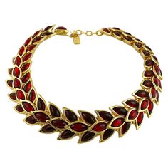 YVES SAINT LAURENT vintage gold toned choker necklace featuring ruby red poured resin in cascading wheat pattern. Extension chain. Hook closure. Embossed YSL Made in France. Indicative measurements : inner circumference from approx. 36.13 cm (14.22 inches) to approx. 42.41 cm (16.70 inches) / width approx. 2.8 cm (1.10 inches). NOTES - This is a preloved vintage item, therefore it might have imperfections. - Colors may differ slightly from actual product appearance due to differences in lighting Valentines Idea, Saint Laurent Jewelry, Ysl Vintage, Saint Laurent Vintage, Vintage Choker Necklace, Vintage Yves Saint Laurent, Black Velvet Choker, Biwa Pearls, Vintage Choker