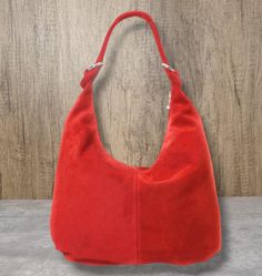 Real Suede Leather Tote bag Slouch Bag Hobo Handbag Suede Leather shoulder bag Top zipped and Silver hardware. Material: Genuine Suede Bag is fully lined inside. 1 zipped pocket and 1 phone pocket. A perfect bag for shopping and carrying daily essentials. Dimension: W 44cm x H 34cm x  variable depth Red Travel Baguette Bag With Large Capacity, Red Baguette Bag With Large Capacity For Travel, Large Capacity Red Baguette Bag For Travel, Red Baguette Bag With Large Capacity For Daily Use, Red Tote Baguette Bag With Removable Pouch, Red Baguette Tote Bag With Removable Pouch, Red Leather Tote Baguette Bag, Red Handheld Bucket Bag For Daily Use, Red Tote Baguette Bag For Shopping