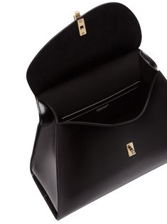 sculpted-handle leather tote bag from Ferragamo featuring black, leather, gold-tone hardware, internal logo stamp, sculpted handle, foldover top, twist-lock closure, multiple internal slip pockets and main compartment. Size Info UNI Color Detail Black Made In Italy Material Outer: Calfskin 100% Lining: Goat Skin 100% Season One Fall-Winter Season Two Fall-Winter Product bags.. Brand Ferragamo Size And Fit Width 12,2 in / 31 cm Height 9,45 in / 24 cm Depth 5,31 in / 13,5 cm Ferragamo Bag, Luxury Designer Handbags, Bags Black, Ferragamo Belt, Belt Accessories, Logo Stamp, Satchel Handbags, Leather Tote Bag, Small Bags