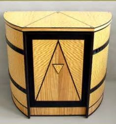 a wooden box with a triangle on the front and sides, made out of wood